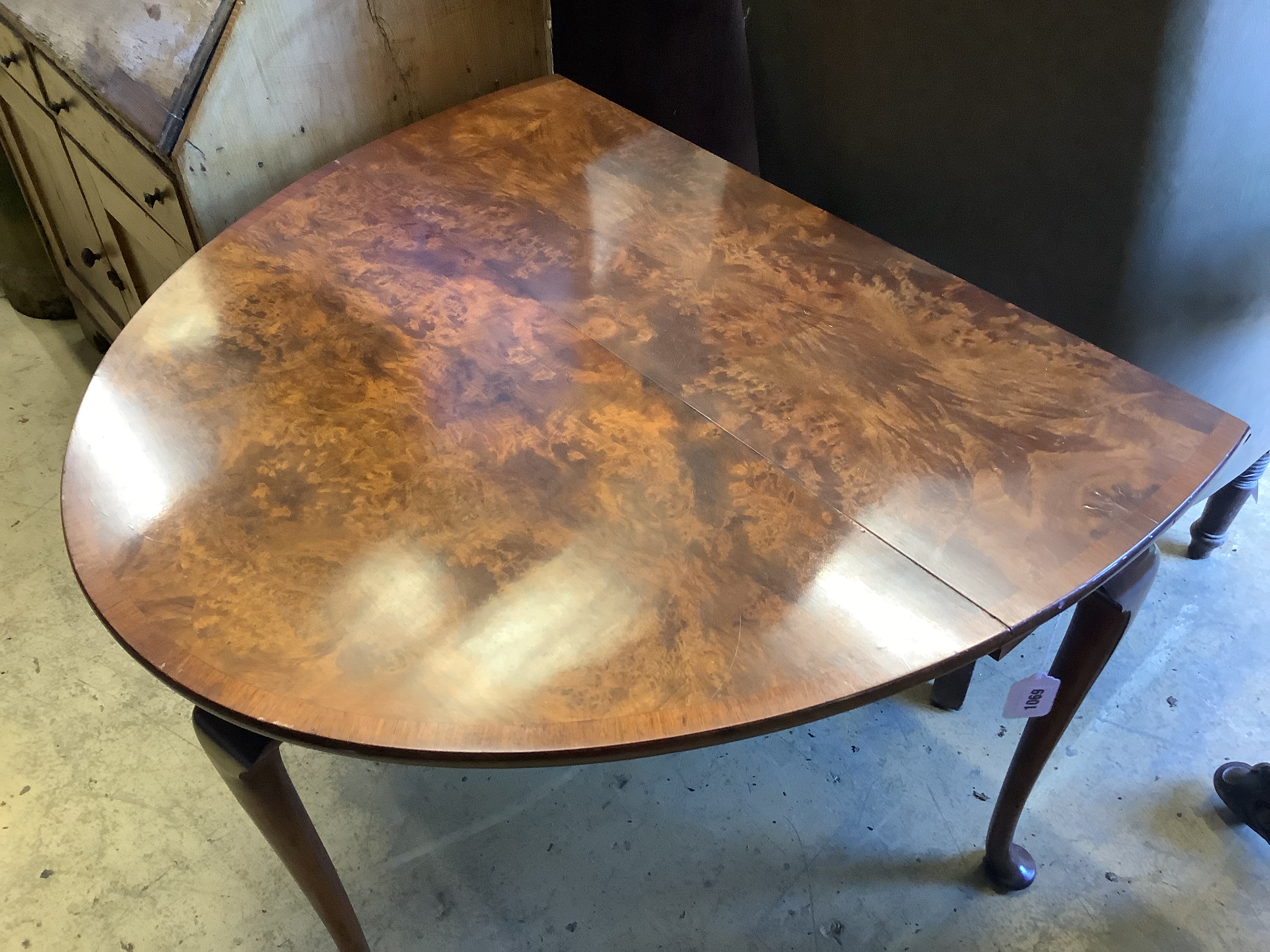 A Queen Anne style figured walnut oval pad foot drop leaf dining table, width 90cm, length 120cm extended, height 73cm